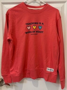 Life Is Good Coral Crewneck Sweatshirt with Teacher Hearts Graphic